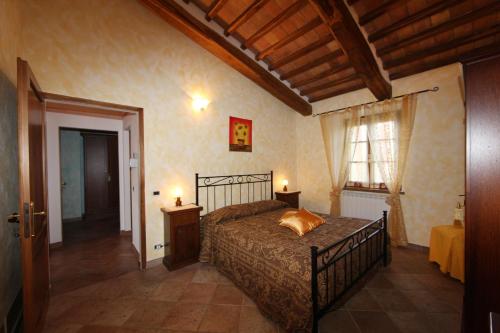 מיטה או מיטות בחדר ב-Agriturismo Bagnaia