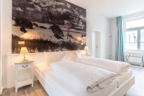 Cama ou camas em um quarto em Ria‘s Beachhouse