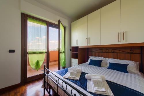 Postel nebo postele na pokoji v ubytování Domus Fiera di Roma Village