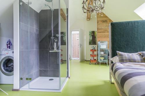 a master bedroom with a shower and a bed at HOMEBOUND APARTMENTS Salzburg City II - contactless check-in in Salzburg