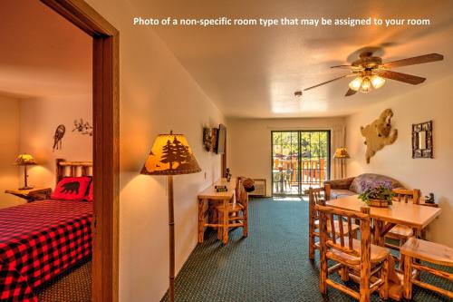 a bedroom with a bed and a dining room at Meadowbrook Resort in Wisconsin Dells