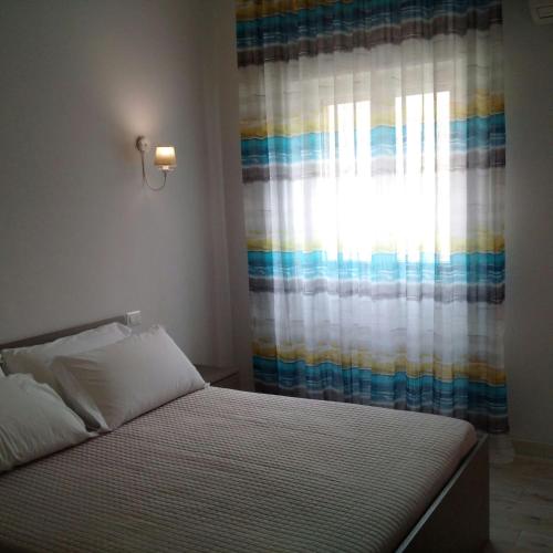 Ένα ή περισσότερα κρεβάτια σε δωμάτιο στο Casa Vacanze De Nittis