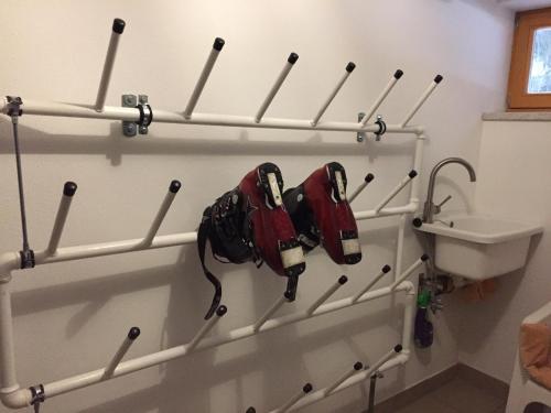 a group of baseball equipment hanging on a wall at Ferienwohnung Mujcic in Hermagor