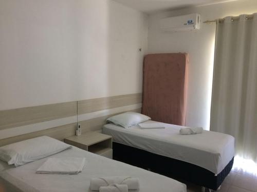 Postel nebo postele na pokoji v ubytování Apart Canoa Quebrada