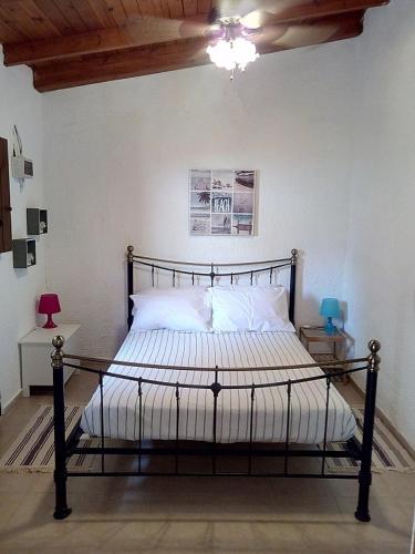 a bedroom with aokedokedoked bed in a room at Traditional House in Elounda in Elounda