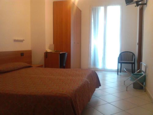 Letto o letti in una camera di Hotel Adriana