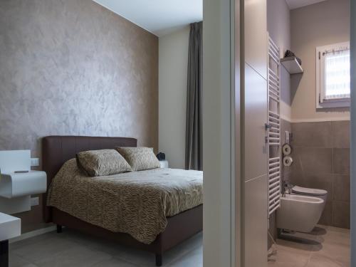 A bed or beds in a room at Hotel Buena Onda