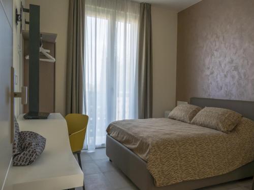 A bed or beds in a room at Hotel Buena Onda