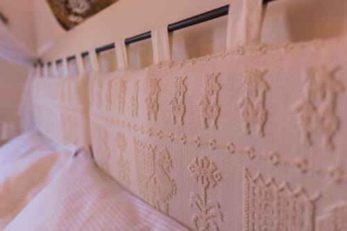 a close up of a bed with a pink headboard at CelesteDiMare in Palau