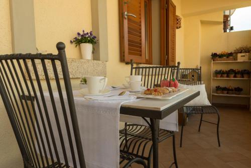 a table with a plate of food on it at CelesteDiMare in Palau