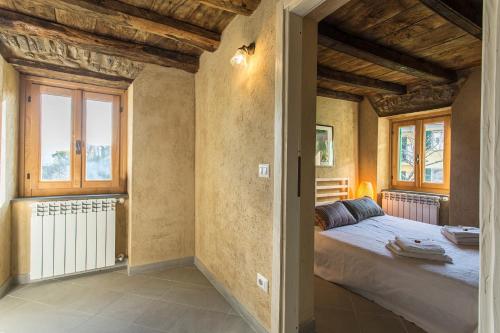 Giường trong phòng chung tại Villa Amamòse