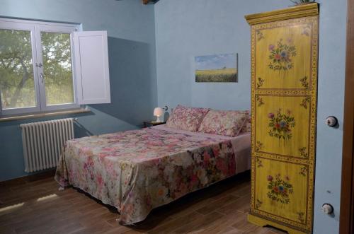 Llit o llits en una habitació de Rifugio Nel Bosco