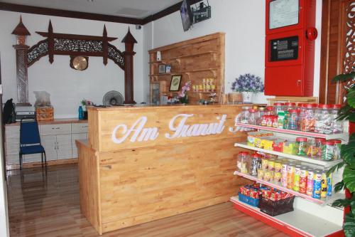 a store with a counter with drinks on it at AM Transit Inn Kuala Terengganu in Kuala Terengganu