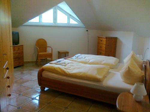 a bedroom with a bed and a skylight at Villa Caprivi - 12 in Heringsdorf