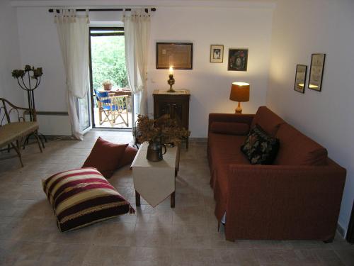 a living room with two couches and a table at VytinaHouse in Vitina