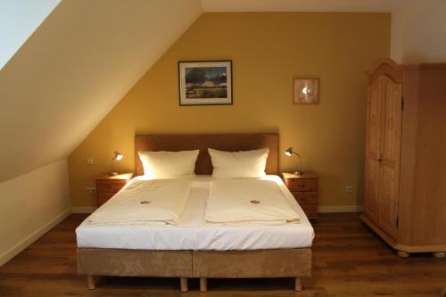 Katil atau katil-katil dalam bilik di Hotel im Kavalierhaus
