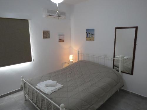 Postel nebo postele na pokoji v ubytování Adonis Apartment
