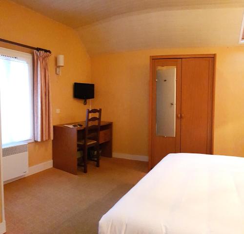 Ένα ή περισσότερα κρεβάτια σε δωμάτιο στο Le Mogador