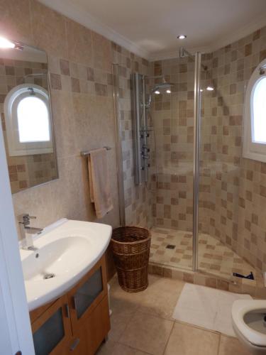 a bathroom with a sink and a shower at Villa Amare in Benissa