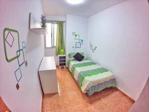 Postel nebo postele na pokoji v ubytování Piso 7 Personas Wifi 1GB