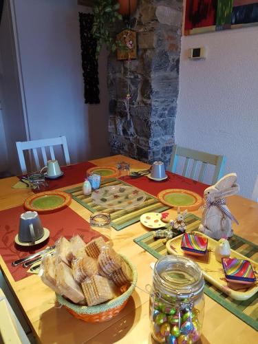 a dining room table with food and decorations on it at B&B La Cà De La Frà in Gravedona