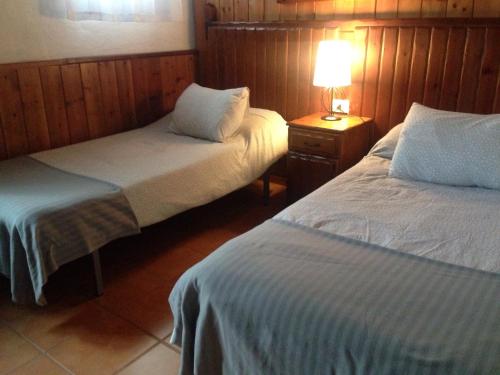 Ένα ή περισσότερα κρεβάτια σε δωμάτιο στο Finca El Cantero