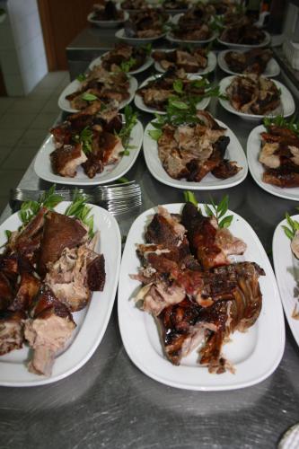 a group of plates of food on a table at Hotel Domu Incantada in Muravera