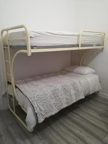 a bunk bed in a room with a bedsheet and a pillow at 100% Lisbon in Lisbon