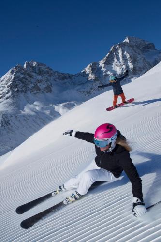 a person is laying in the snow on skis at Hotel Rosatsch in Pontresina
