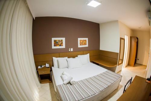 Cama ou camas em um quarto em Mundial Parque Hotel