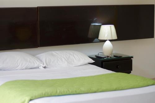 Postel nebo postele na pokoji v ubytování Apartamentos Casa Brenes