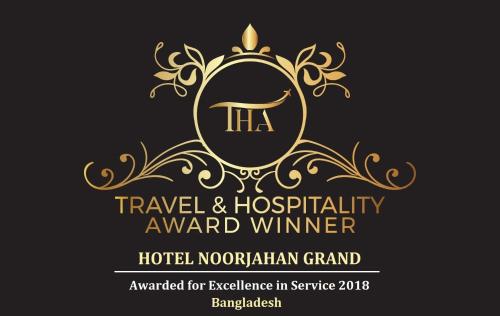 a wedding invitation with a gold insignia and a crest at Hotel Noorjahan Grand in Sylhet