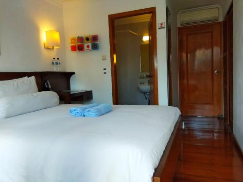 Una cama o camas en una habitación de Jos & Hanny Homestay