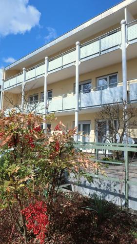 a large building with a balcony in front of it at Hotel Christine in Radolfzell am Bodensee