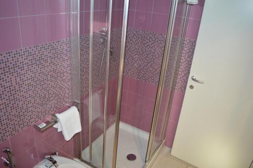 a bathroom with a shower with a toilet and a sink at Alloggio Le Macine in Ferrara