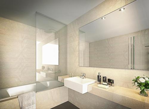 a bathroom with a sink and a mirror at Crown Hotel Changwon in Changwon