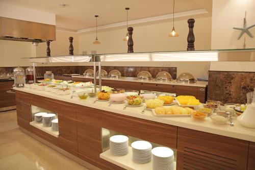 a buffet with a lot of food on display at Lacosta Hotel in Aqaba