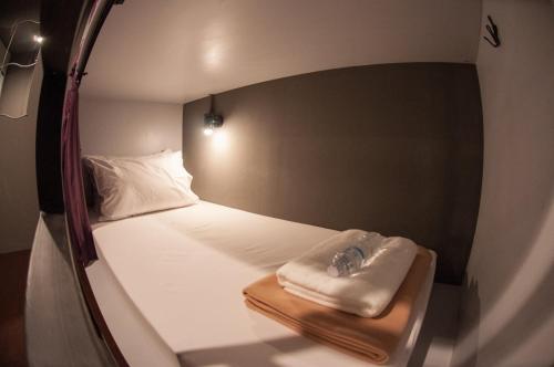 Postel nebo postele na pokoji v ubytování Tian Tian Hostel