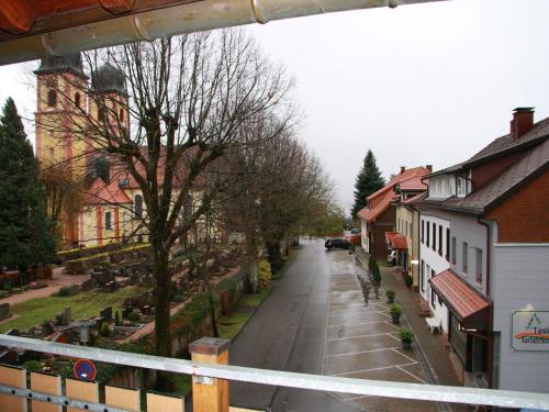 an empty street in a small town with houses at Ferienwohnung Christa in Sankt Märgen