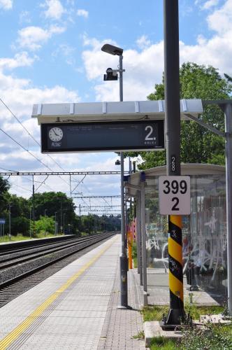 a train station with a sign at a train station at Hotel Svornost in Prague