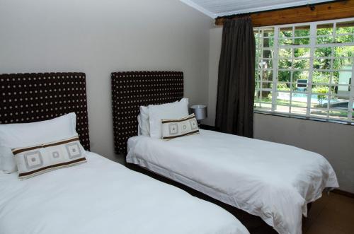 Ένα ή περισσότερα κρεβάτια σε δωμάτιο στο Mountain Creek Lodge