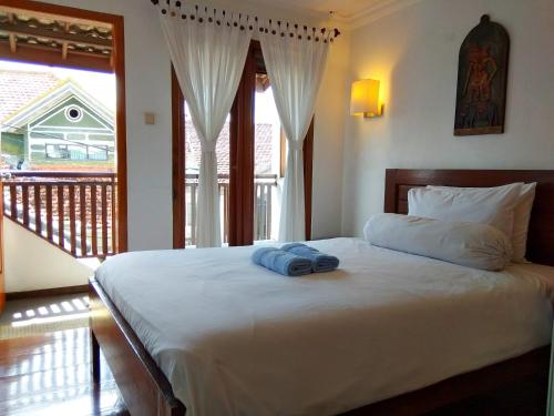 Postel nebo postele na pokoji v ubytování Jos & Hanny Homestay