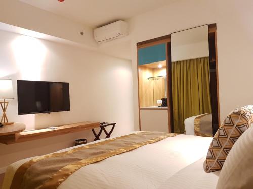 Ferra Hotel and Garden Suitesにあるベッド