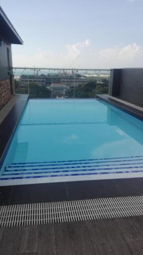 a large swimming pool on top of a building at YulZ 516 at Cityscape in Bacolod