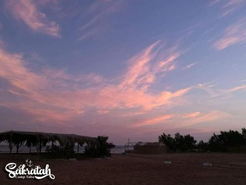 a view of a cloudy sky over a beach at SakraTah Camp - eco friendly in Taba