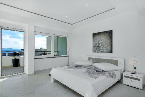 Posteľ alebo postele v izbe v ubytovaní Penthouse Lush Makarska