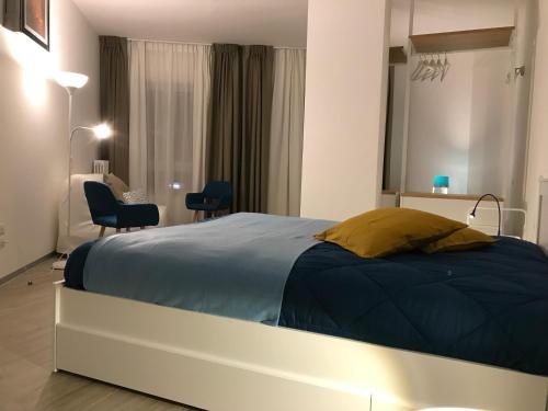 a bedroom with a large bed in a room at A Matera "Sotto i pini" in Matera
