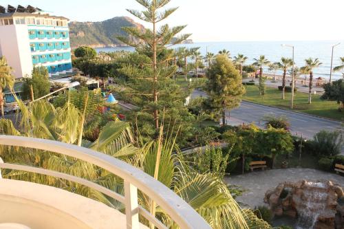 a view from the balcony of a resort with a christmas tree at Belle Ocean Apart Otel in Alanya
