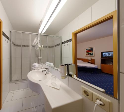 Ванная комната в Hotel Gasthof Adler