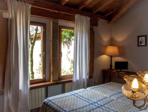 Ένα ή περισσότερα κρεβάτια σε δωμάτιο στο Enclave Soria